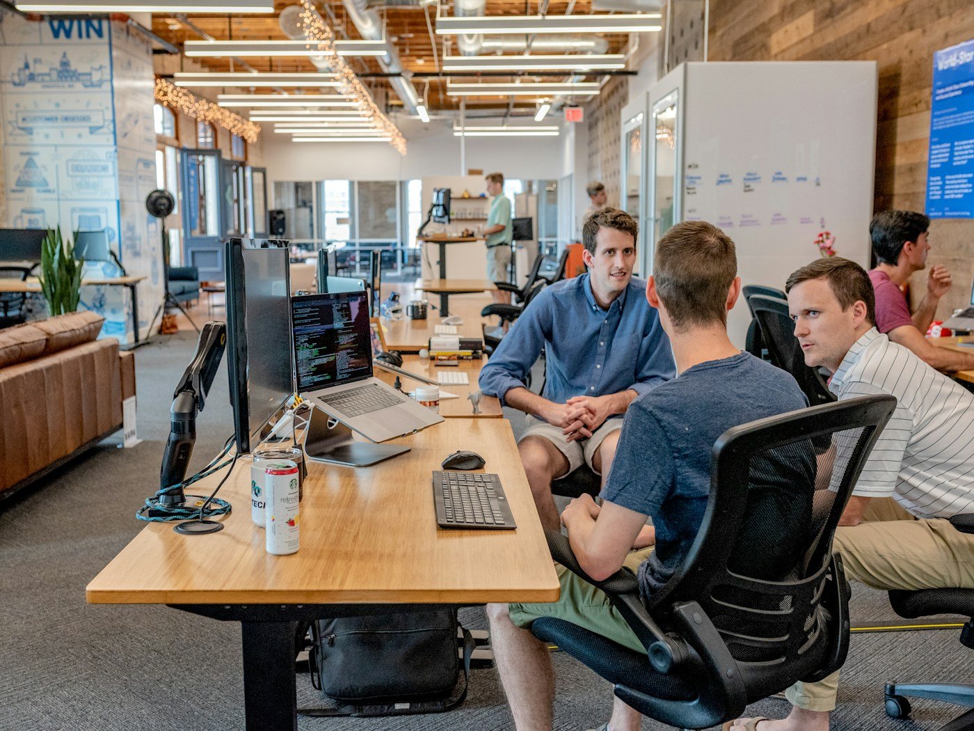 Colleagues discussing work in a meeting