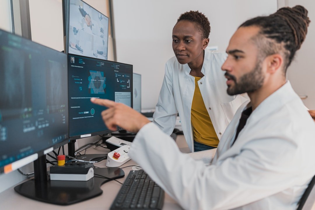 AI and machine learning team reviewing model results on a computer screen