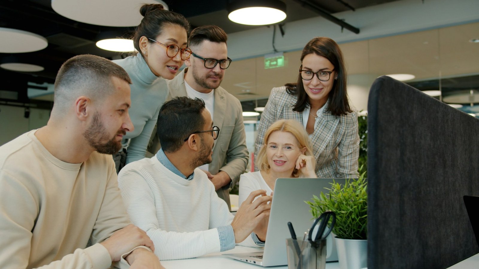 Business team collaborating on a project in a modern office